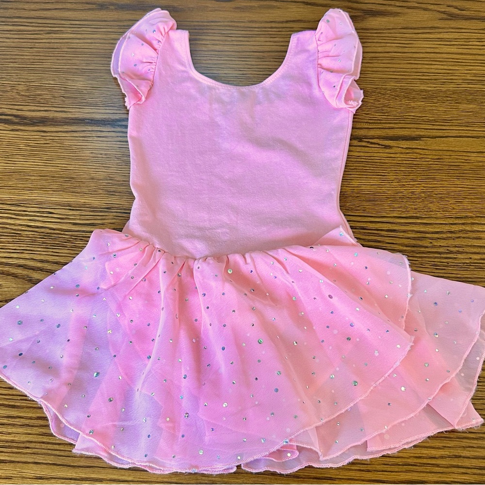 Pink dance leotard with attached skirt in excellent condition!